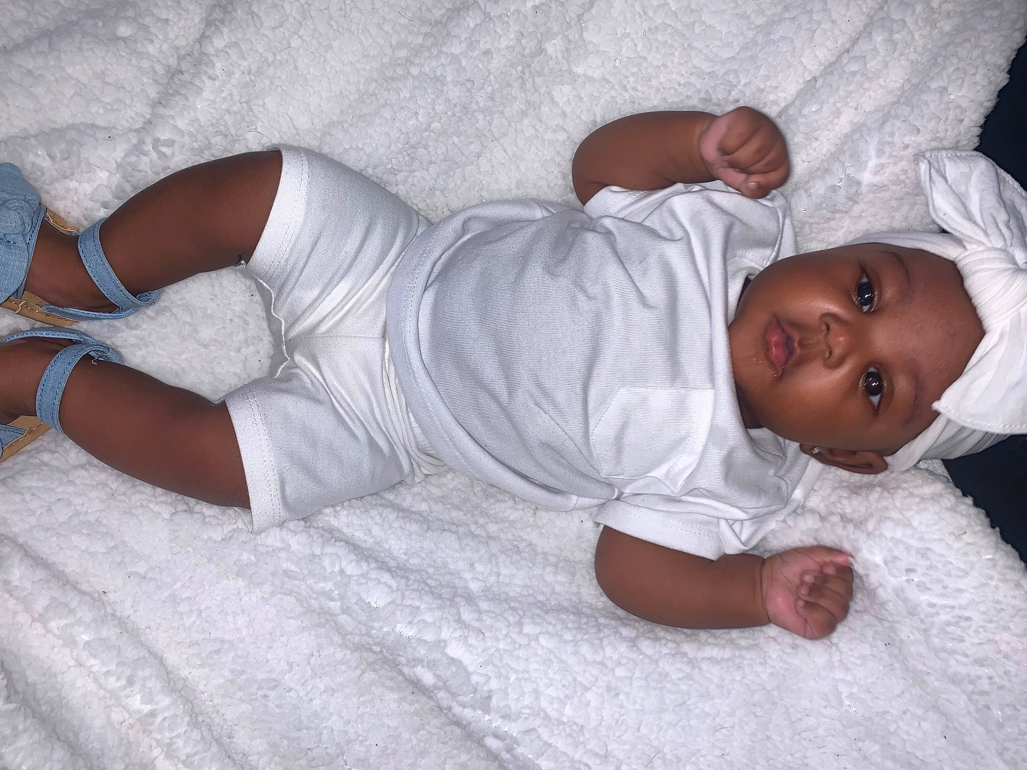 Joyce is registered to the contest to win money with this photo: abdomen, arm, baby, baby_sleeping, baby_toddler_clothing, child, comfort, elbow, finger, foot, headwear, human_body, human_leg, joint, knee, linens, person, skin, sleeve, thigh