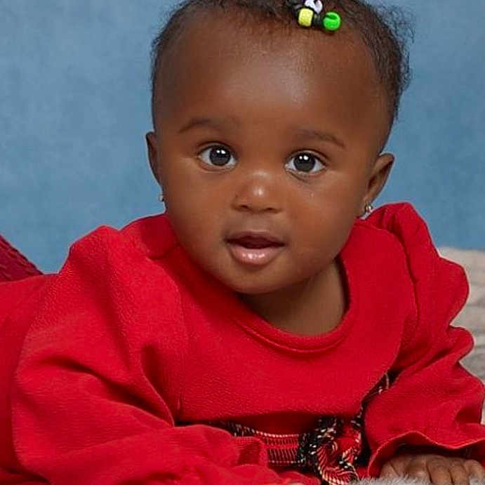 Nyemiah joined the competition — help win amazing prizes! adorable, baby, background, blue_background, child, cute, earrings, expression, eyes, face, fuzzy, hair_clip, infant, lying_down, person, portrait, red_clothing, smile, soft_surface, young_child