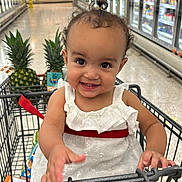 Suleyka joined the competition — help win amazing prizes! aisle, baby, child, curly_hair, cute, cute_expression, food, grocery_store, happy, indoor, person, pineapple, produce, retail, shopping, shopping_cart, smiling, supermarket, toddler, white_dress