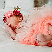 Brianna is registered to the contest to win money with this photo: baby, baby_bloomers, ballet_tutu, child, costume, dress, fashion_accessory, flower, hair_accessory, headband, headgear, headpiece, photograph, photography, pink, plant, product, red, skin, toddler