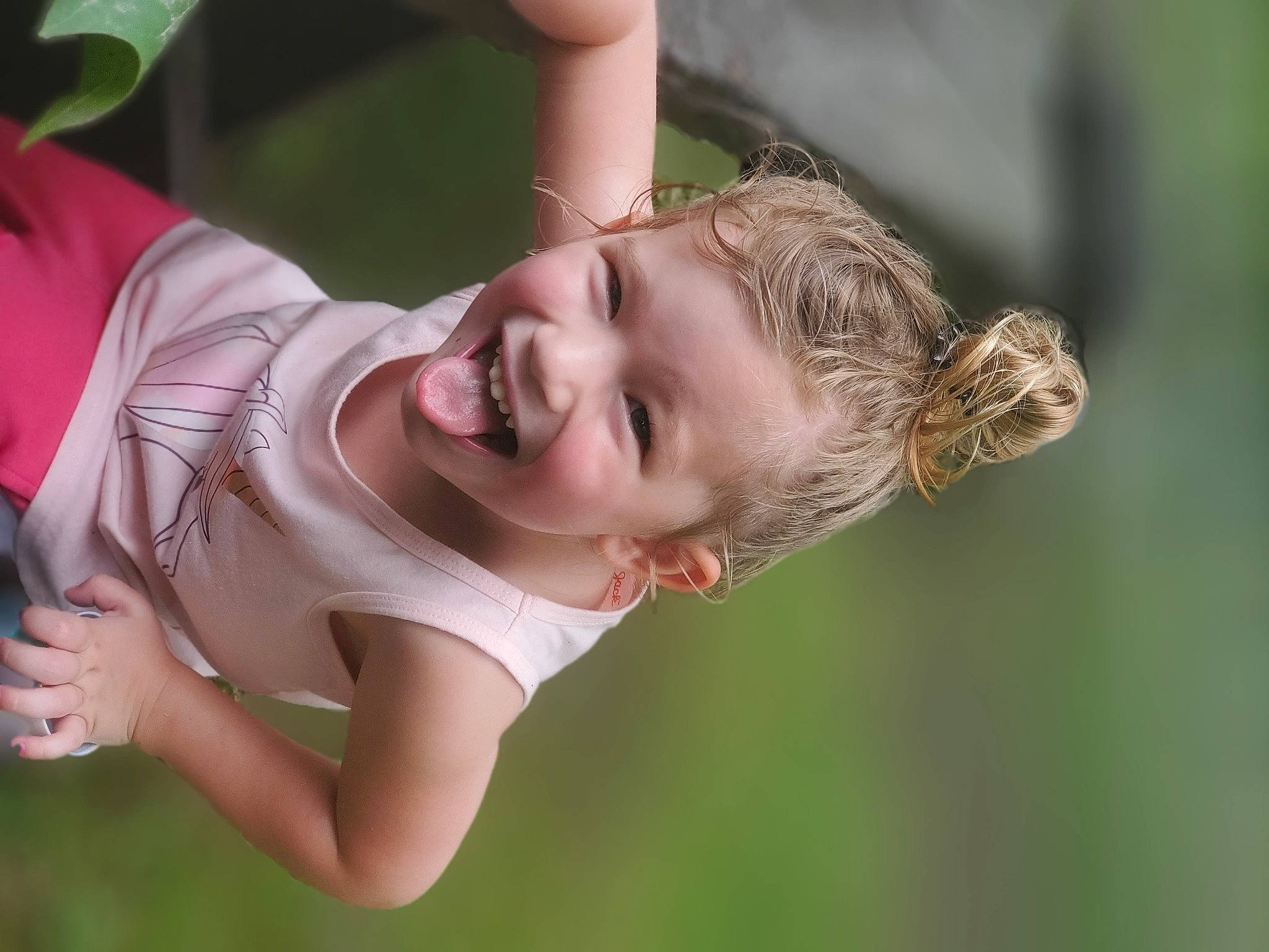 Dixie is registered to the contest to win money with this photo: blond, brown_hair, child, elbow, flash_photography, fun, gesture, grass, hand, happy, laugh, leisure, lip, people_in_nature, person, plant, recreation, skin, smile, toddler