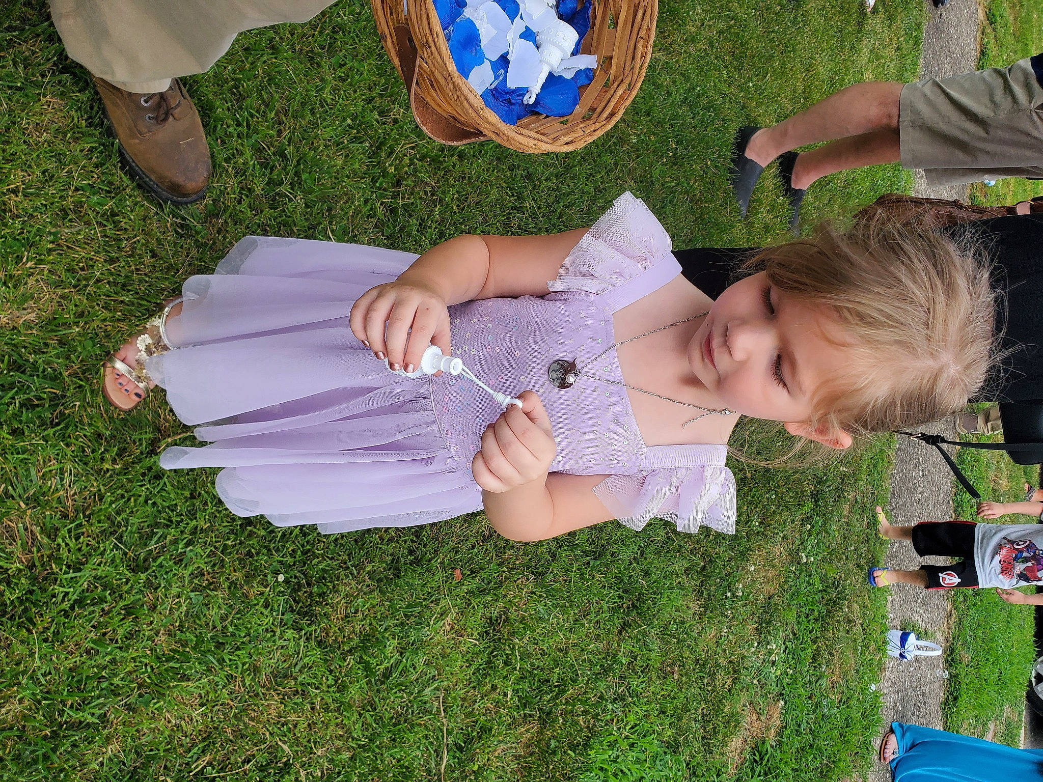 Dixie is registered to the contest to win money with this photo: baby_toddler_clothing, blue, child, electric_blue, event, foot, fun, gesture, grass, green, happy, human_leg, lawn, leisure, person, recreation, sandal, smile, toddler, white