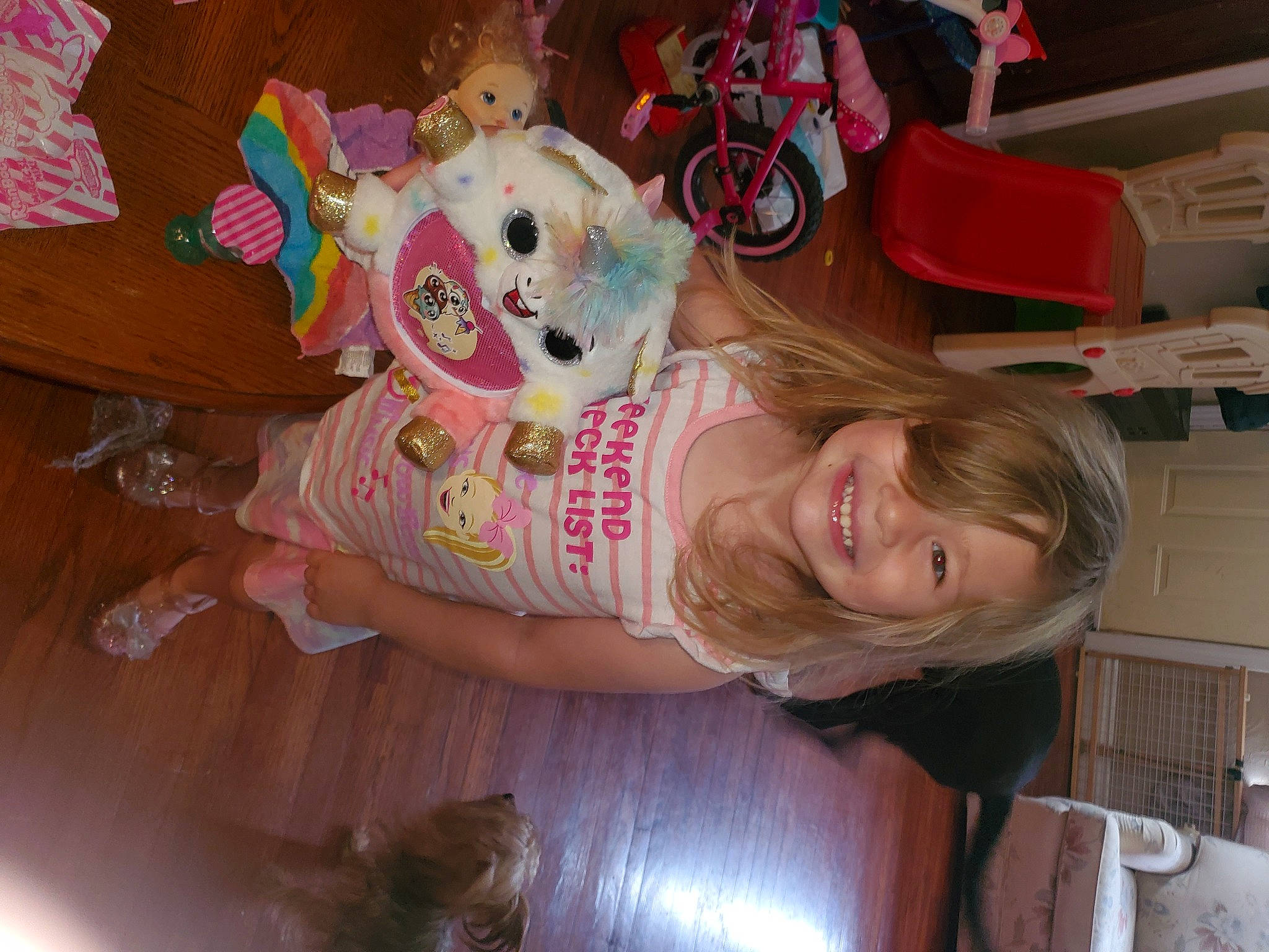 Dixie is registered to the contest to win money with this photo: baby, bicycle, child, event, fun, happy, holiday, joy, party, people, person, photography, pink, room, smile, snapshot, tire, toddler, toy, vacation