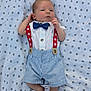 Knoxtin is registered to the contest to win money with this photo: baby, infant, boy, clothing, bow_tie, suspenders, striped_shorts, blanket, pattern, dots, cute, portrait, newborn, laying_down, barefoot, fashion, summer, outdoor, soft_texture, relaxed