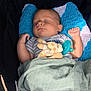 Knoxtin is registered to the contest to win money with this photo: baby, blanket, child, clothing, comfort, crocheted_pillow, cute, face, hand, head, indoors, infant, napping, pacifier, peaceful, plush_toy, resting, sleeping, soft, stroller