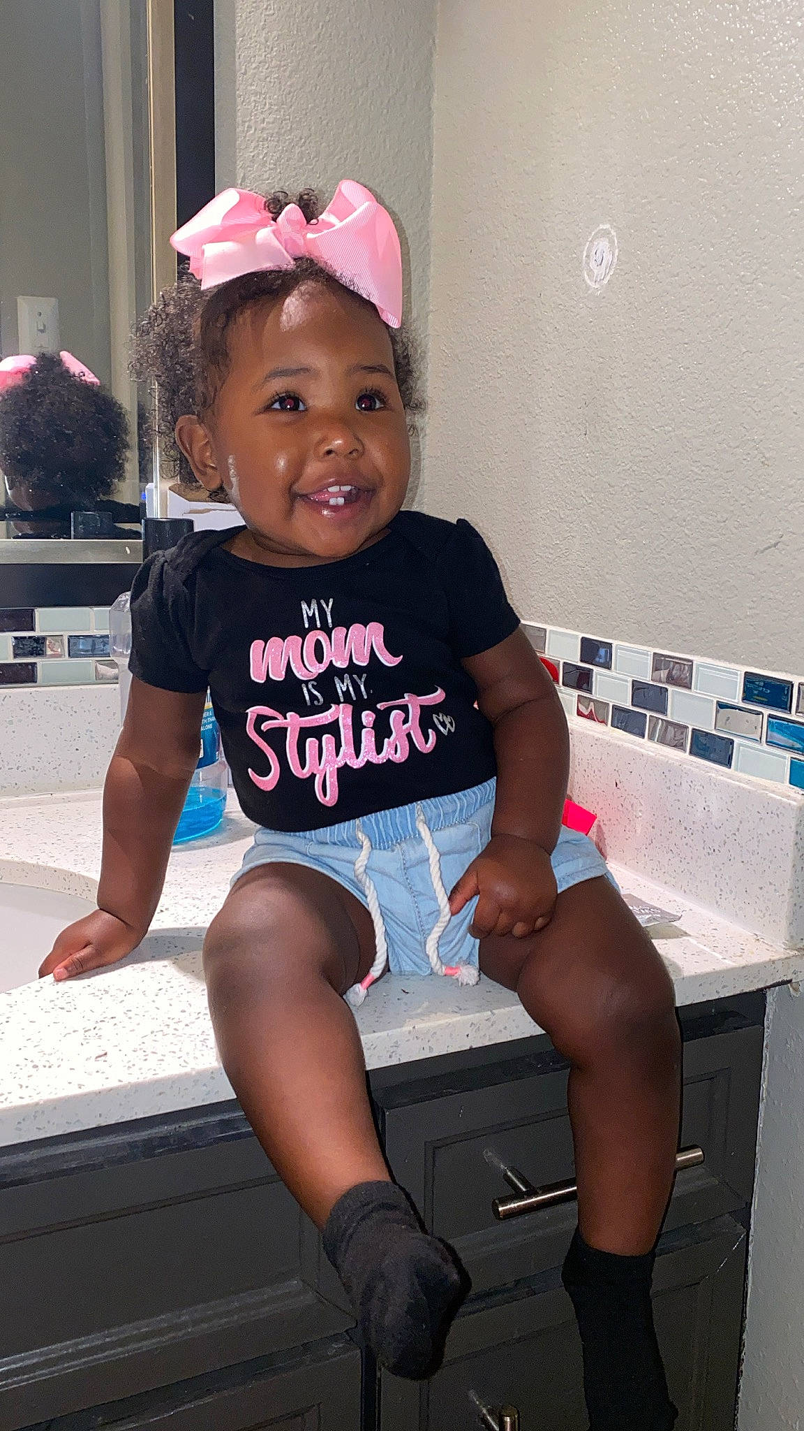 Emani joined the competition — help win amazing prizes! baby_toddler_clothing, baseball_cap, black, cap, fashion, happy, headgear, knee, leg, magenta, person, pink, shorts, skin, sleeve, smile, standing, t_shirt, thigh, toddler
