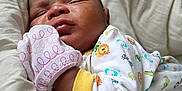 Kaleb is registered to the contest to win money with this photo: baby, sleeping, blanket, onesie, mittens, pacifier, infant, cozy, cute, animal_print, soft, resting, newborn, child, portrait, indoors, comfort, peaceful, cute_outfit, bed