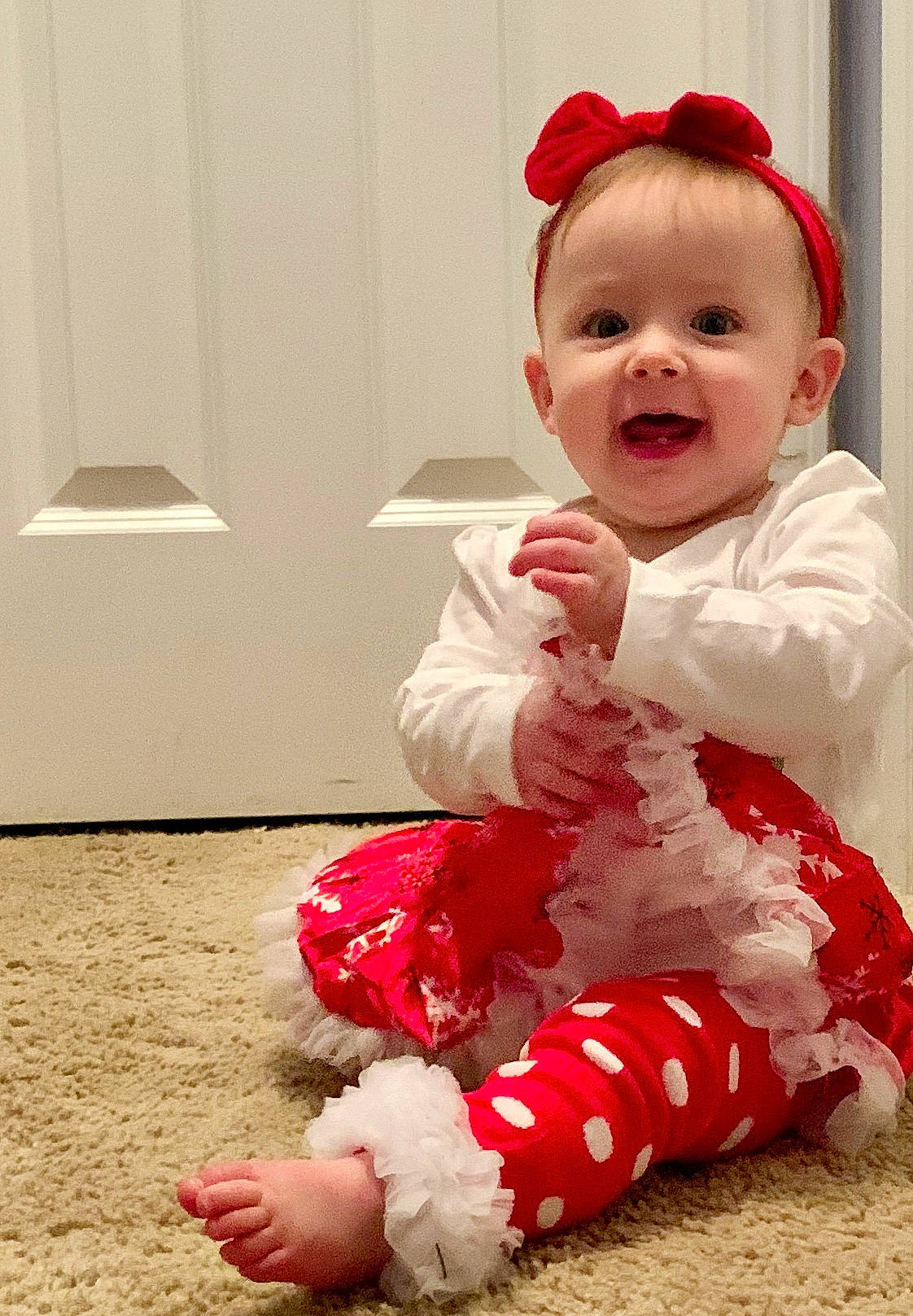 Kailee joined the competition — help win amazing prizes! baby, baby_toddler_clothing, cheek, child, christmas, christmas_eve, costume, fashion_accessory, fur, head, person, pink, red, sitting, skin, sleeve, smile, toddler, white