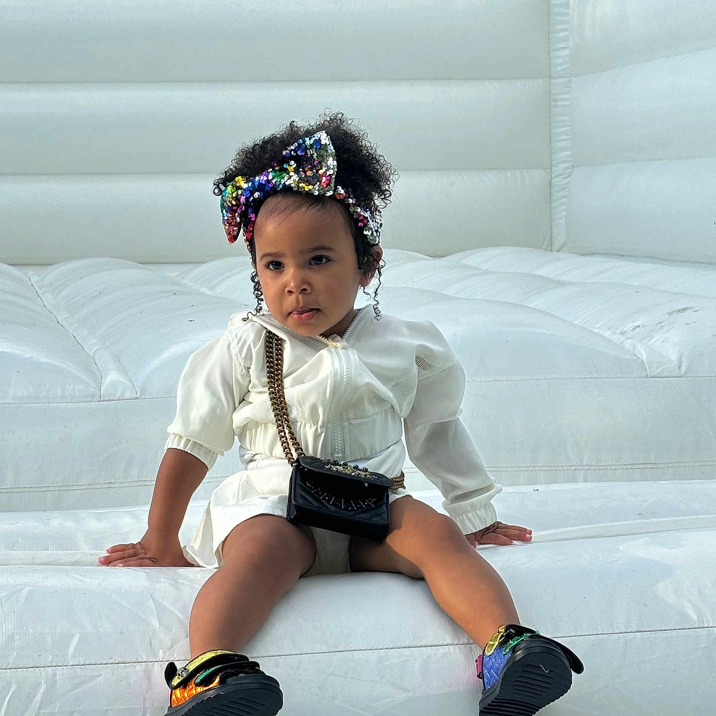 Gianna joined the competition — help win amazing prizes! accessories, bag, child, clothing, couch, face, female, footwear, furniture, girl, handbag, head, pants, person, photography, portrait, shoe, shorts, sitting, sleeve