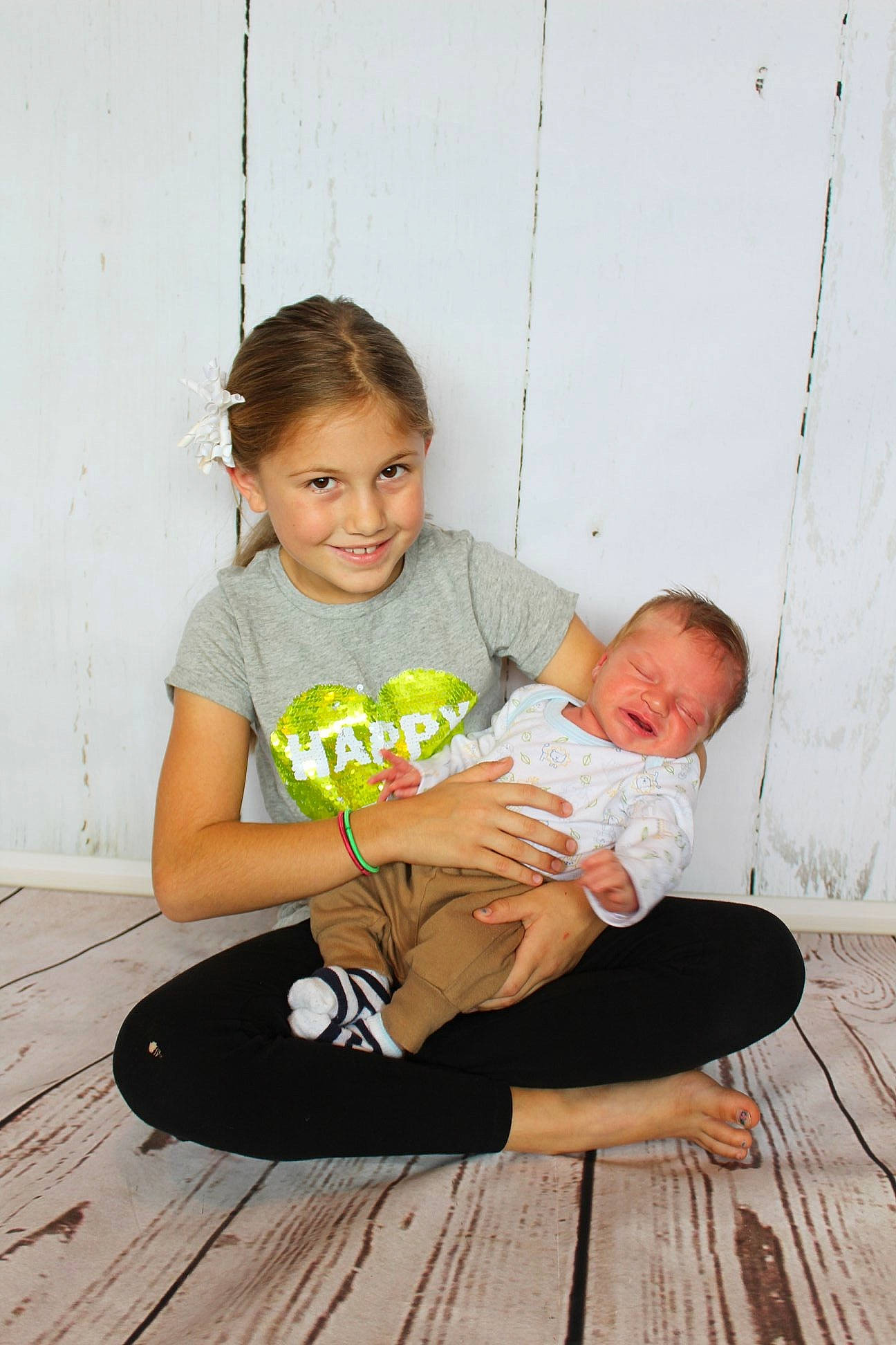 Haylie is registered to the contest to win money with this photo: child, floor, flooring, fun, furniture, infant, joy, person, play, product, sitting, toddler, trunk