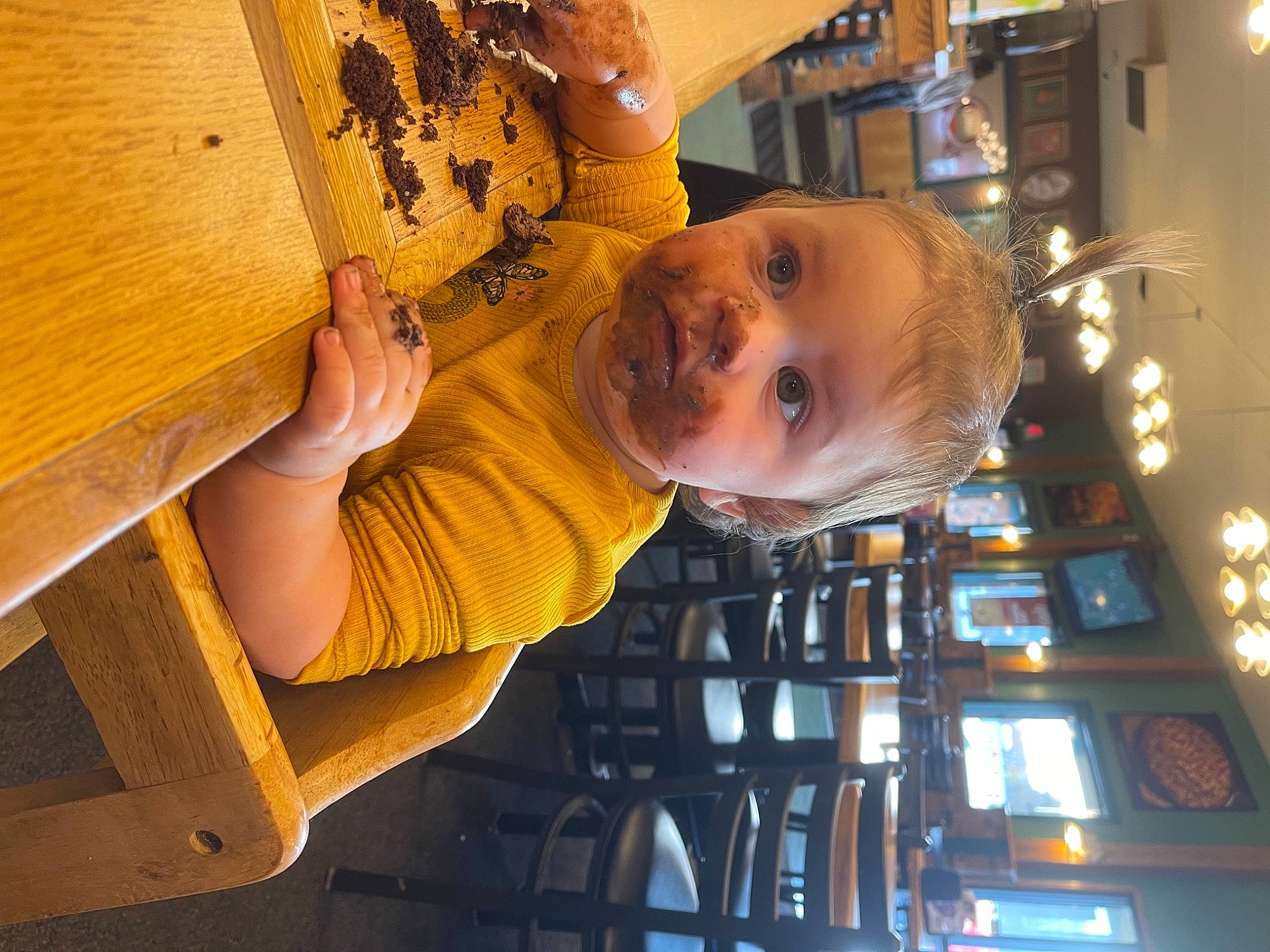 Opal is registered to the contest to win money with this photo: building, chair, child, food, fun, happy, machine, pattern, person, room, smile, t_shirt, toddler, wood, wood_stain