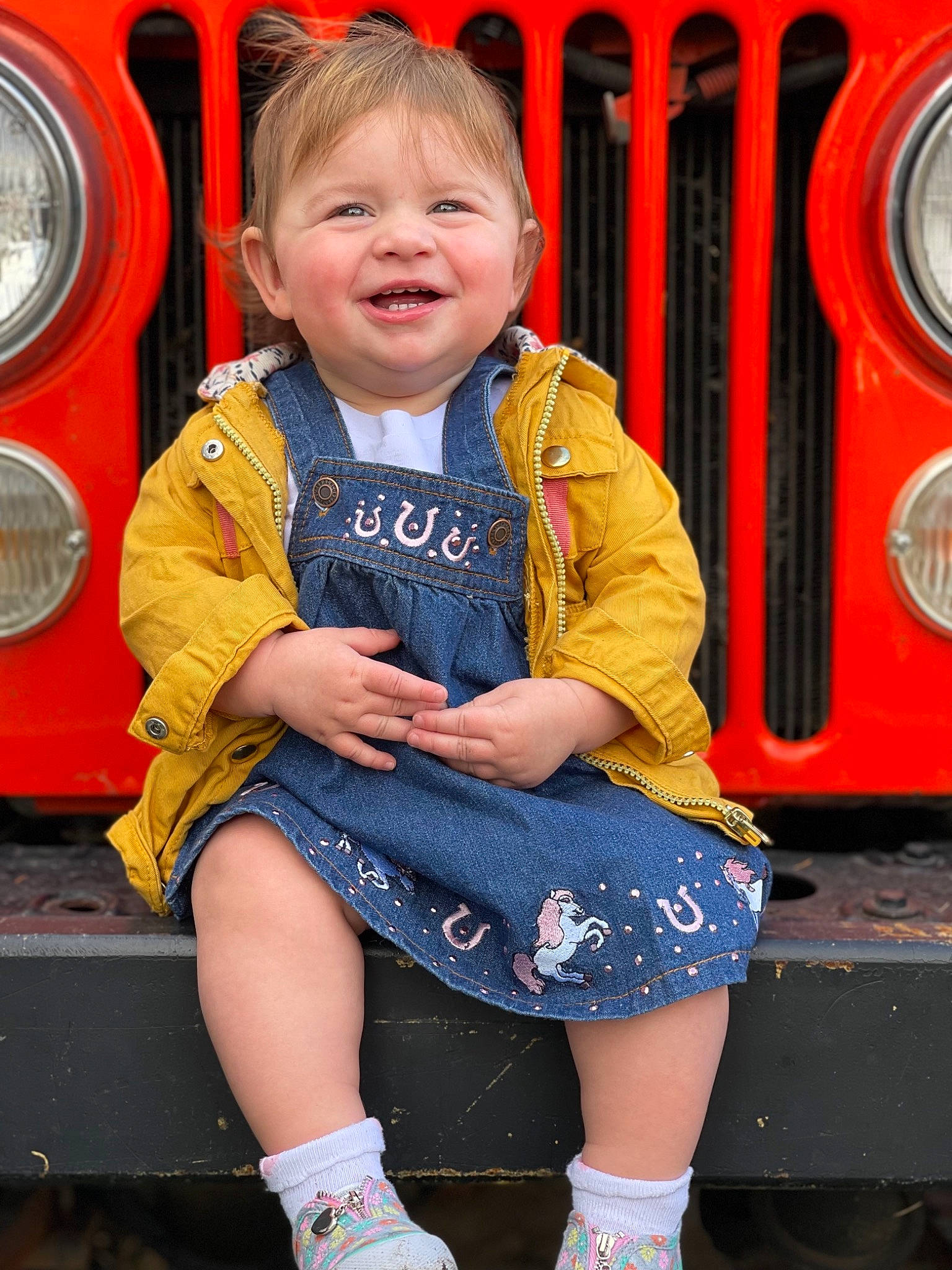Opal joined the competition — help win amazing prizes! automotive_lighting, automotive_tire, blue, child, face, facial_expression, fun, gas, green, happy, motor_vehicle, orange, organ, person, photograph, red, smile, standing, tire, toddler