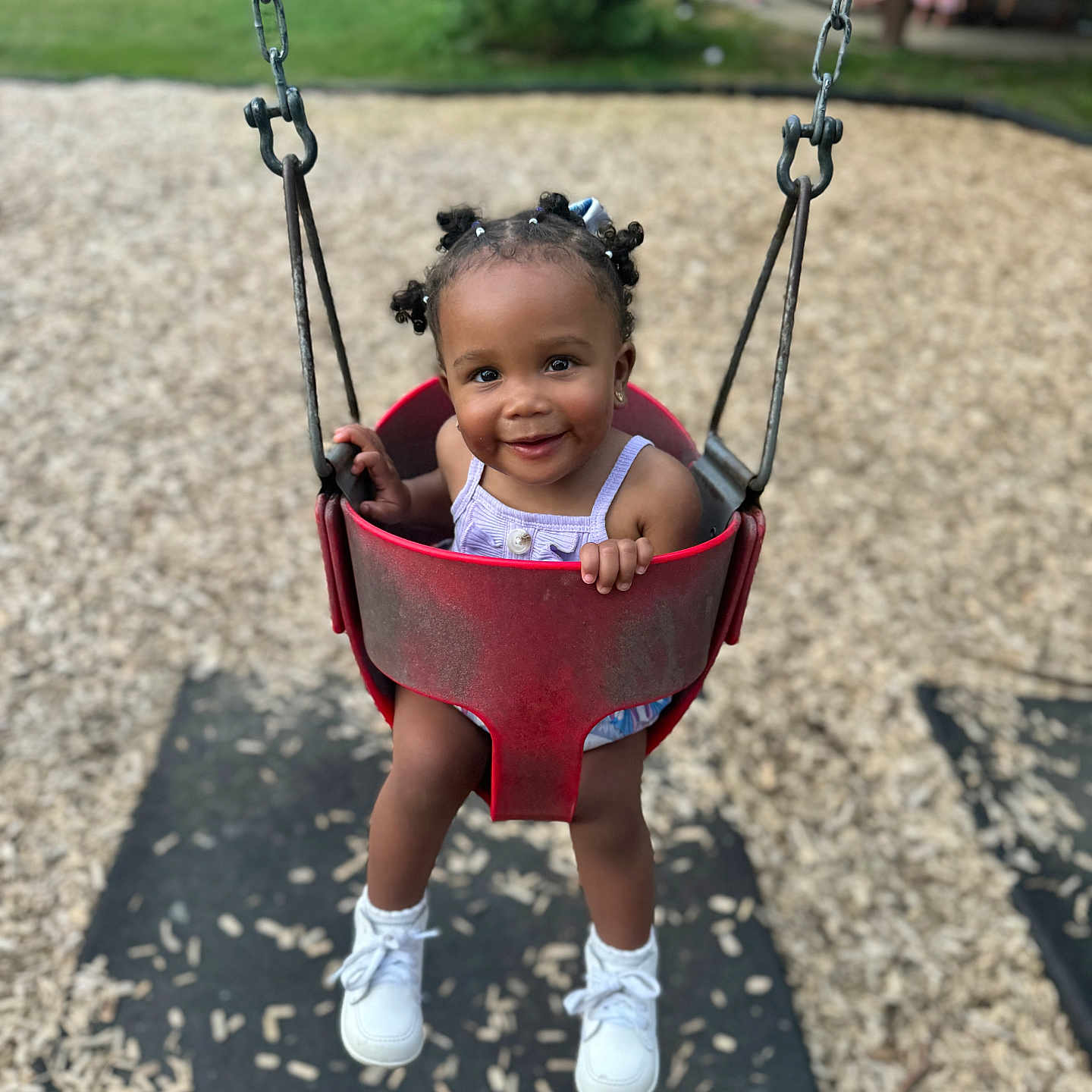 Azari is registered to the contest to win money with this photo: child, clothing, face, female, footwear, girl, grass, head, nature, outdoorplayarea, outdoors, park, person, photography, plant, playarea, portrait, shoe, swing, toy