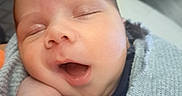 Henry joined the competition — help win amazing prizes! baby, infant, sleeping, yawning, blanket, knit, wrapped, hand, face, cozy, cute, child, portrait, indoors, resting, peaceful, skin, head, mouth, expression