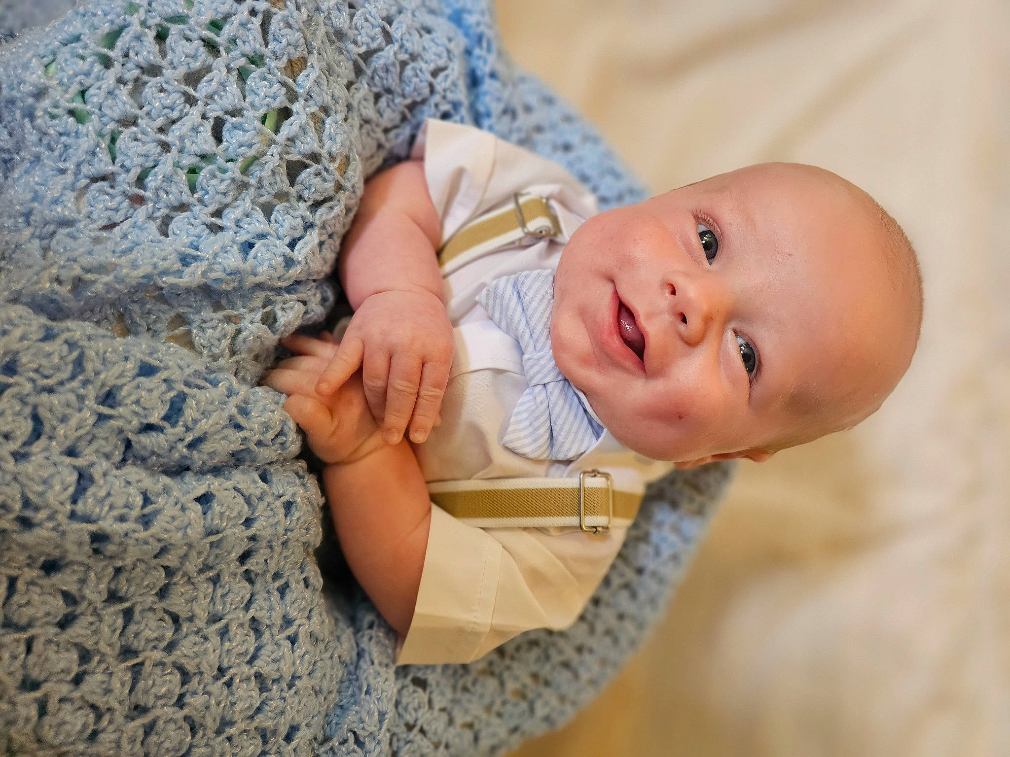 Colt is registered to the contest to win money with this photo: baby, baby_toddler_clothing, child, comfort, fashion_accessory, finger, flooring, grass, hand, happy, linens, nail, pattern, person, portrait_photography, sitting, skin, sleeve, toddler, tree