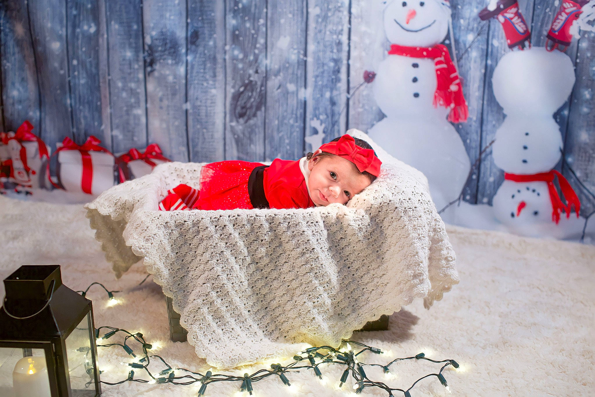 Jessica is registered to the contest to win money with this photo: baby, baby_toddler_clothing, christmas, comfort, costume_hat, event, freezing, fur, happy, hat, headwear, holiday, mammal, person, red, snapshot, snow, snowman, toddler, vertebrate