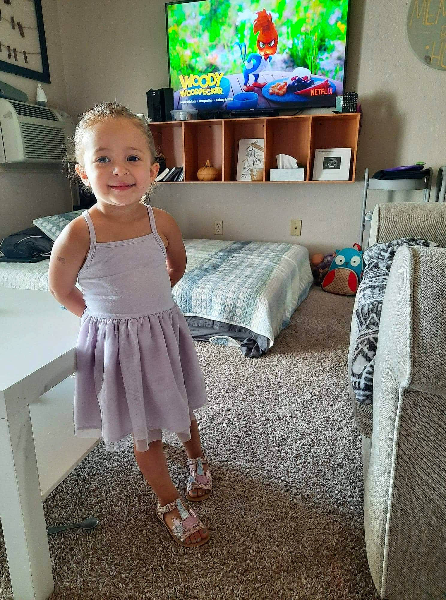 Kinzley joined the competition — help win amazing prizes! baby_toddler_clothing, comfort, couch, day_dress, dress, floor, flooring, furniture, green, happy, human_body, joy, leg, living_room, person, picture_frame, smile, table, television, television_set