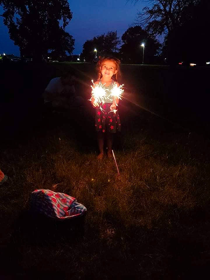 Kinzley is registered to the contest to win money with this photo: asphalt, darkness, electric_blue, event, fire, fireworks, flame, flash_photography, gas, grass, heat, holiday, joy, landscape, midnight, party_supply, person, road_surface, sky, space