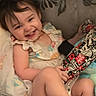 Samantha is registered to the contest to win money with this photo: toddler, child, smiling, playpen, blanket, toy, indoor, happy, cute, clothing, baby, person, sitting, face, pattern, colorful, comfort, infant, fun, joy