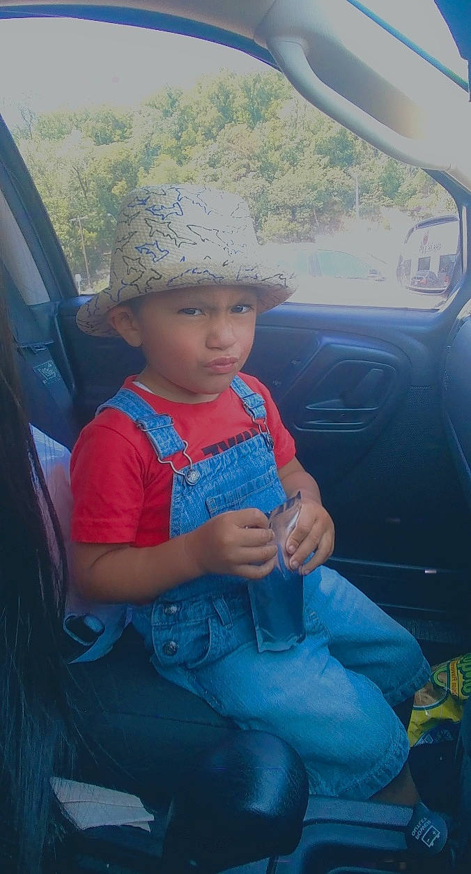 Baby Cesar is registered to the contest to win money with this photo: car, child, family_car, headwear, person, sitting, toddler, vehicle, vehicle_door