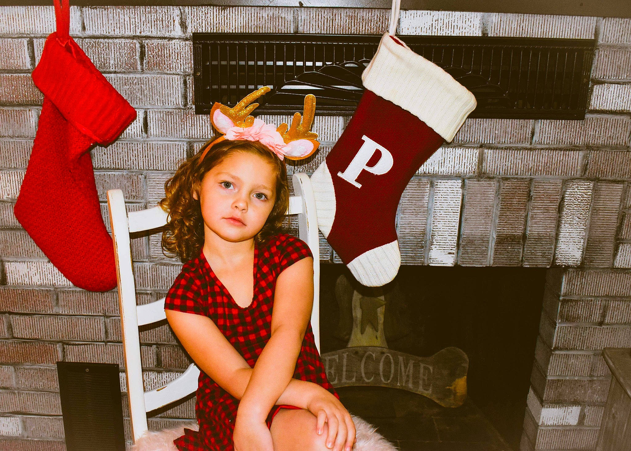 Peightyn is registered to the contest to win money with this photo: baby_toddler_clothing, carmine, child_model, christmas, christmas_stocking, costume, costume_accessory, costume_hat, fictional_character, person, red