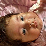 Zoé Ysabella Toledo is registered to the contest to win money with this photo: baby, infant, face, curly_hair, pink_blanket, pink_clothing, owl_design, closeup, lying_down, young_child, skin, eyes, expression, soft_texture, cute, portrait, child, indoors, head, toddler