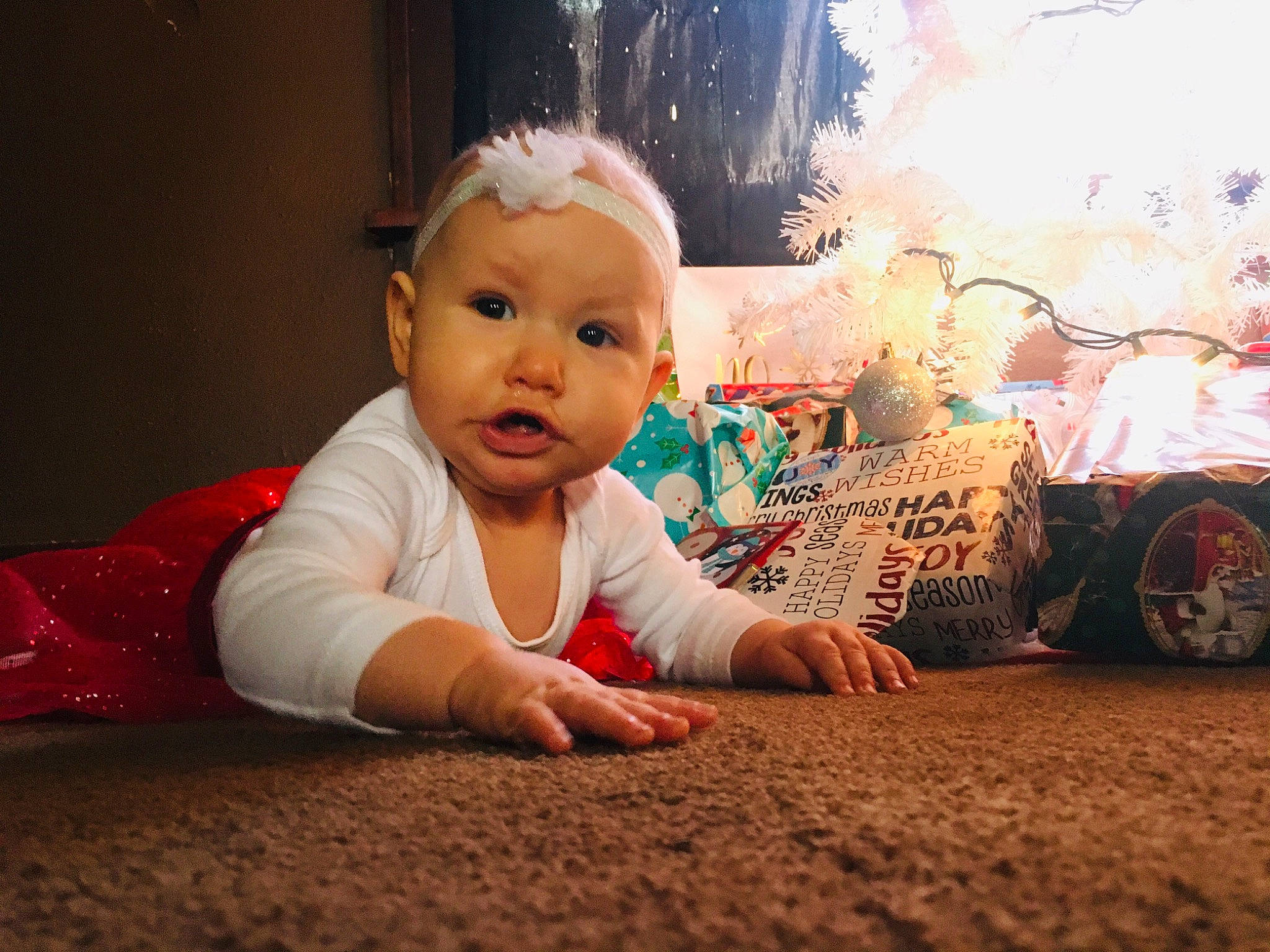 Nevaeh is registered to the contest to win money with this photo: baby, cheek, child, crawling, eye, face, facial_expression, floor, flooring, happy, head, human, nose, person, play, sitting, skin, sky, smile, toddler