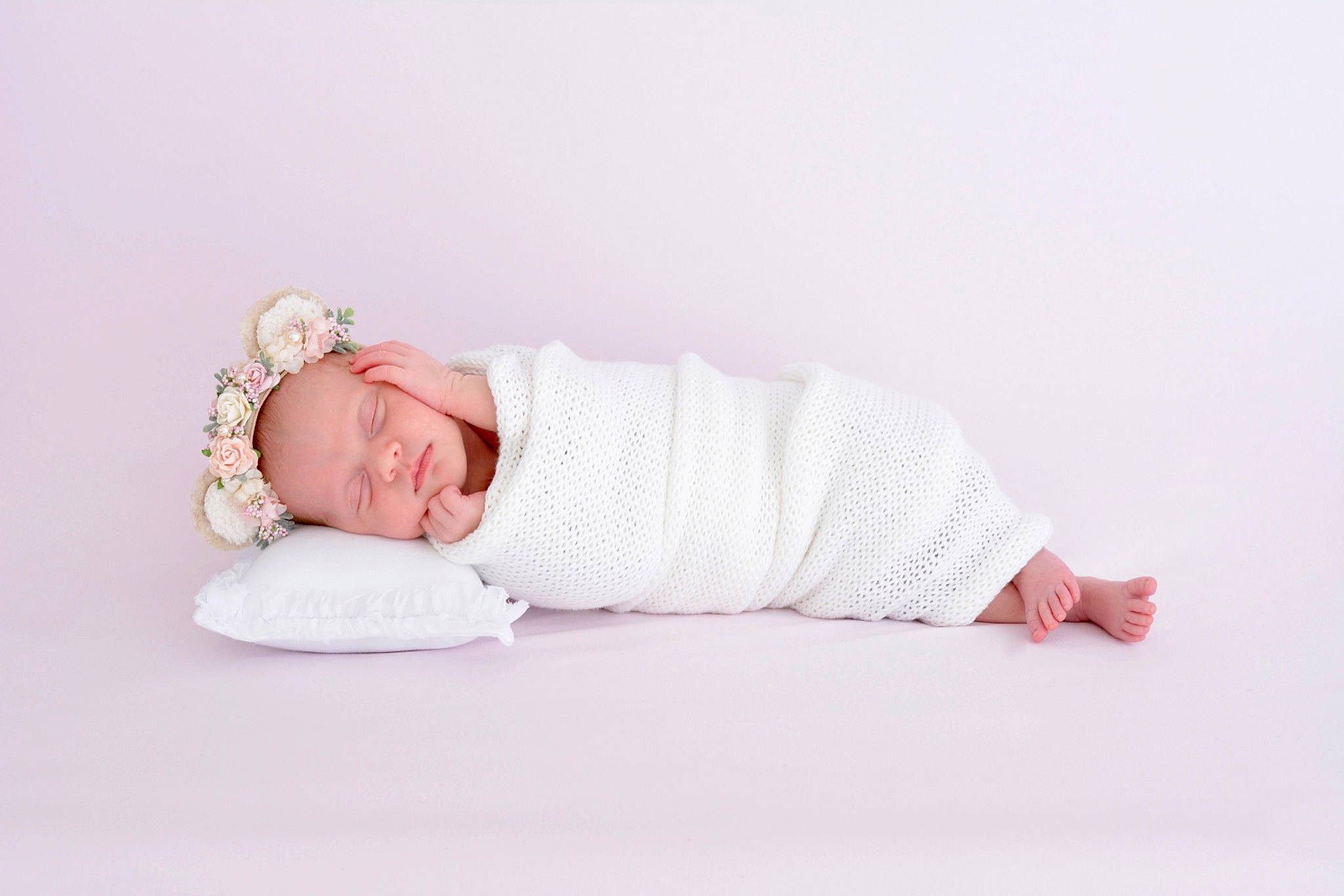 Amelia is registered to the contest to win money with this photo: arm, baby, baby_toddler_clothing, child, comfort, fashion_accessory, flooring, foot, hand, headgear, human_body, jewellery, knee, leg, linens, mammal, pattern, person, sleeve, t_shirt