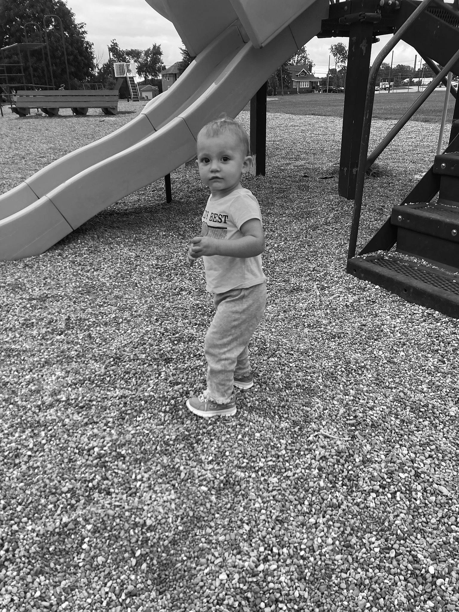 Peyton joined the competition — help win amazing prizes! asphalt, black, black_and_white, child, eye, flooring, grass, leaf, line, monochrome, person, public_space, road_surface, shade, shoe, standing, style, tints_and_shades, toddler, tree