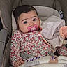 Inaya a rejoint le concours — aidez-le/la à gagner de superbes lots ! baby, blanket, car_seat, child, clothing, cozy, cute, expression, face, floral_outfit, hand, indoors, infant, pacifier, person, portrait, seatbelt, soft_toy, striped_blanket, young_child