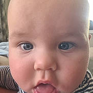 Charlie joined the competition — help win amazing prizes! baby, face, close_up, blue_eyes, drool, striped_clothing, child, innocent, curious, mouth_open, cheeks, skin, head, person, indoor, portrait, expression, young, cute, infant