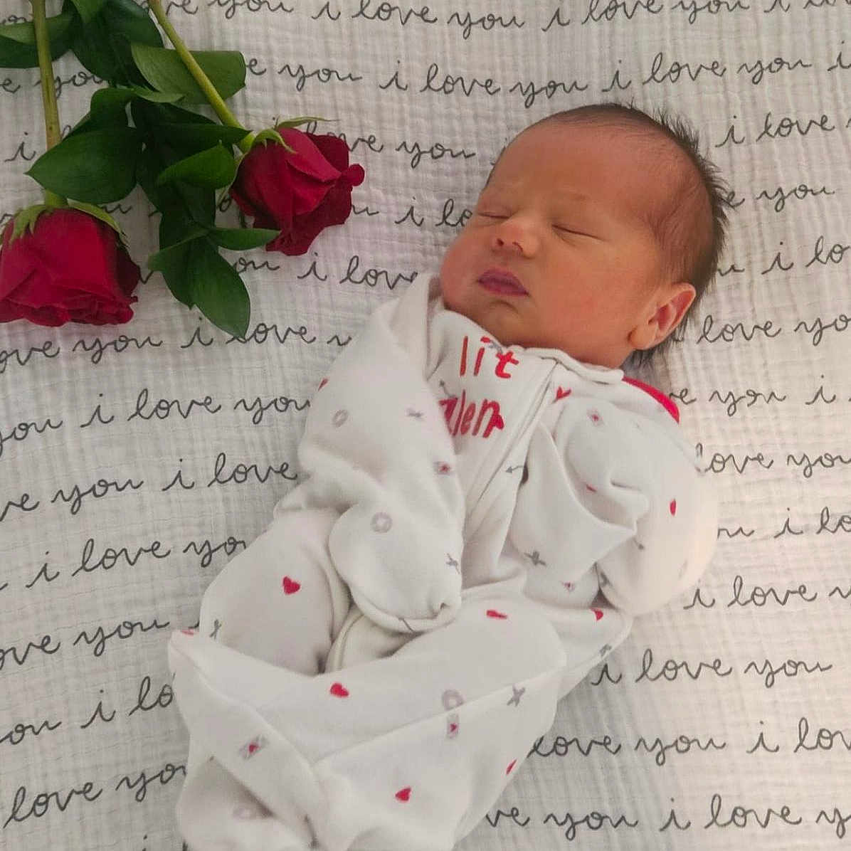 Enzo is registered to the contest to win money with this photo: baby, blanket, face, flower, flowerarrangement, flowerbouquet, geranium, head, leaf, letter, newborn, person, petal, photography, plant, portrait, quilt, rose, sleeping, text