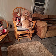 Lucky is registered to the contest to win money with this photo: animal, carpet, cat, couch, cozy, fan, furniture, home, indoor, living_room, orange_cat, pet, plush_toy, relaxing, rocking_chair, rug, seat_cushion, teddy_bear, window, wooden_chair