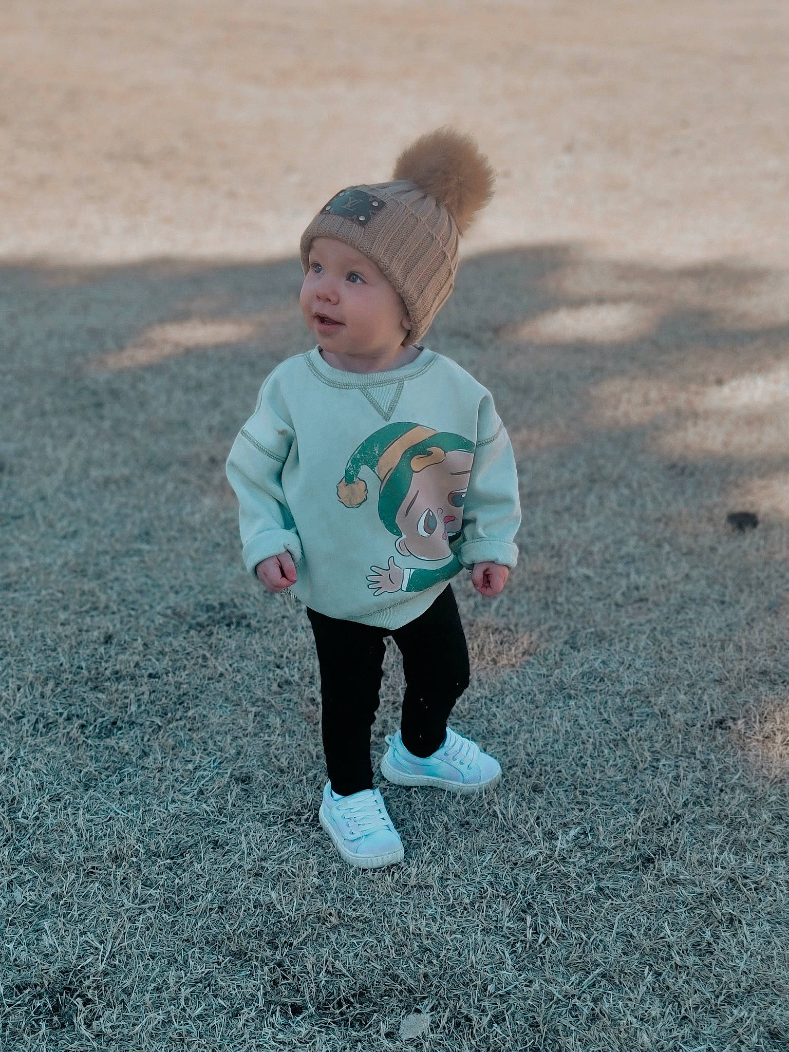 Ava is registered to the contest to win money with this photo: asphalt, azure, baby, baby_toddler_clothing, cap, child, grass, happy, headwear, landscape, people_in_nature, person, recreation, running, sand, shadow, sleeve, t_shirt, toddler, tree