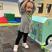 Nova joined the competition — help win amazing prizes! toddler, child, playroom, toy, food_truck, basket, carpet, cushions, play, happy, smiling, clothing, shoes, indoor, fun, young_child, pretend_play, furniture, colorful, expression