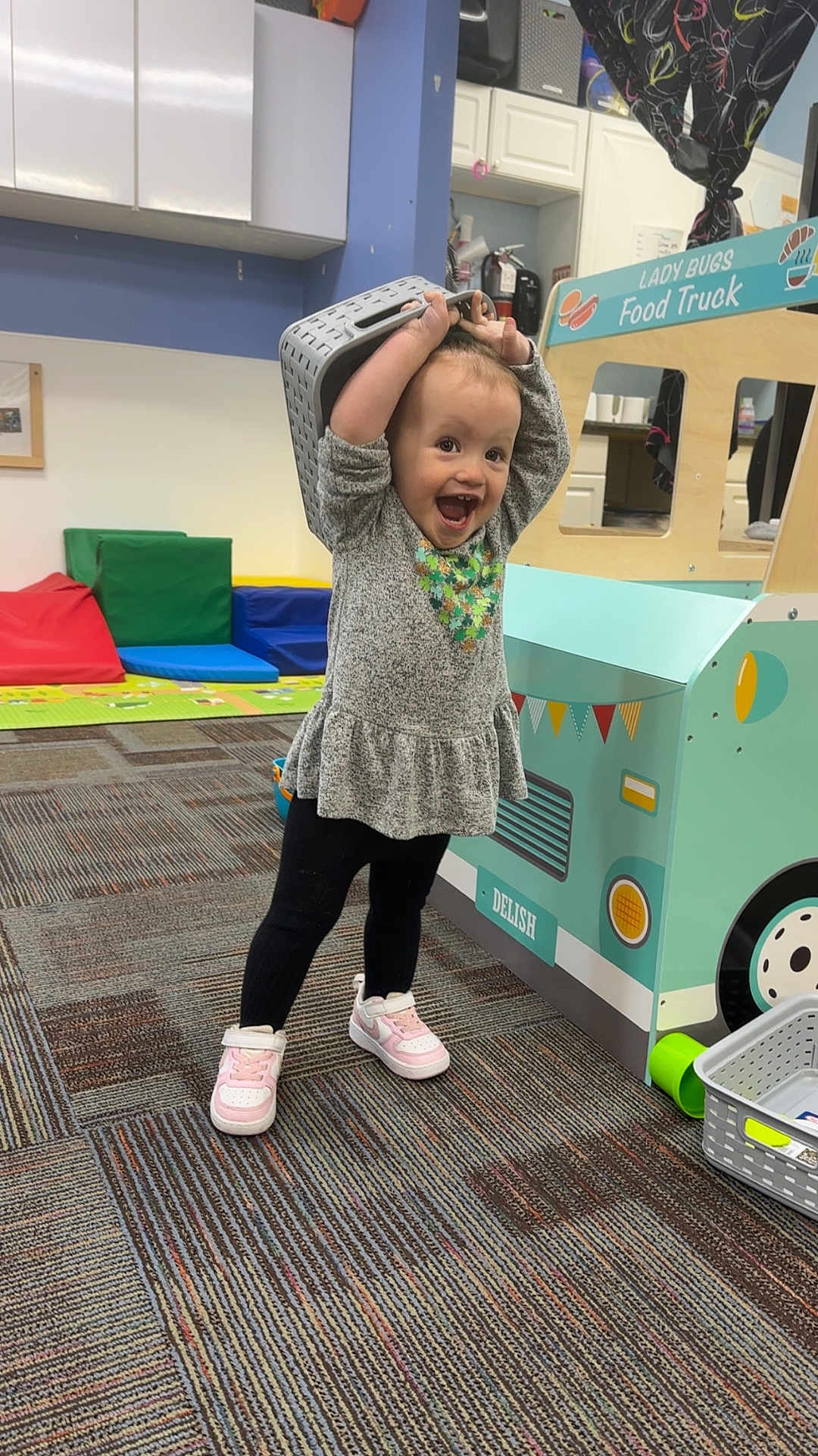 Nova joined the competition — help win amazing prizes! toddler, child, playroom, toy, food_truck, basket, carpet, cushions, play, happy, smiling, clothing, shoes, indoor, fun, young_child, pretend_play, furniture, colorful, expression