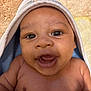 Isaiah joined the competition — help win amazing prizes! baby, infant, smiling, face, eyes, mouth, skin, hooded_towel, blanket, close_up, happy, child, cute, portrait, newborn, chubby_cheeks, indoors, soft_texture, warm, person