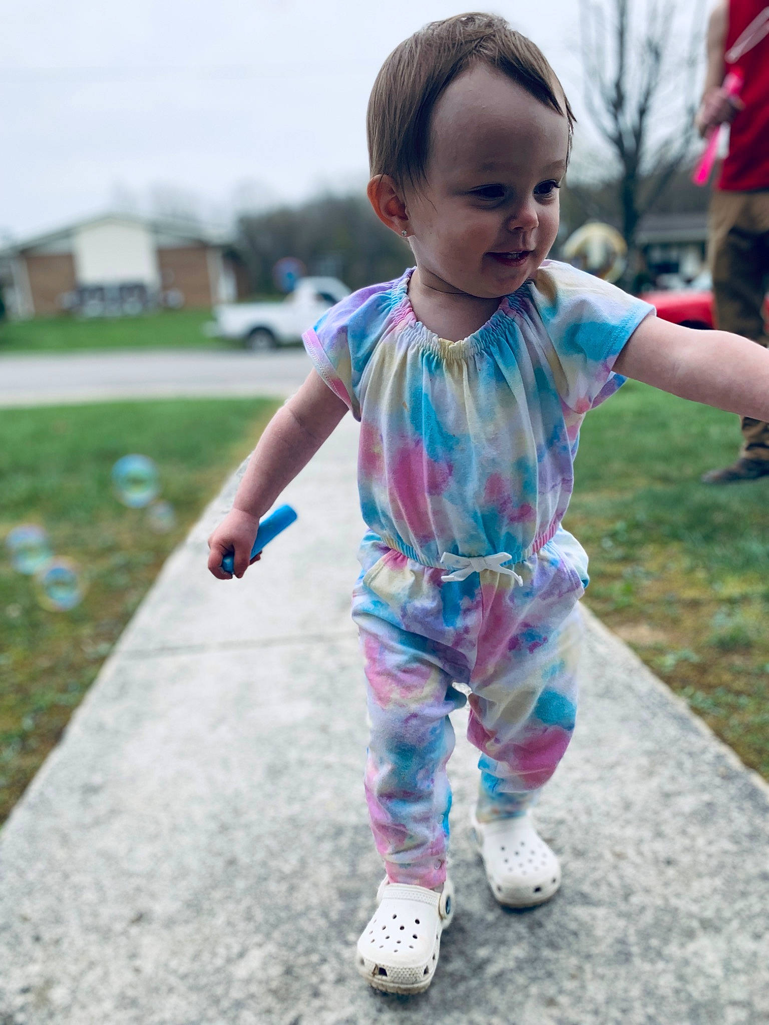 Hadlee is registered to the contest to win money with this photo: baby, baby_toddler_clothing, body_of_water, child, electric_blue, fun, grass, hairstyle, happy, leisure, pattern, people_in_nature, person, play, recreation, shorts, sky, sleeve, smile, t_shirt
