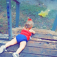 Bella Rose is registered to the contest to win money with this photo: azure, electric_blue, fun, grass, happy, human_leg, leisure, ocean, people_in_nature, recreation, shorts, sitting, summer, sunlight, t_shirt, thigh, toddler, vacation, water, wood