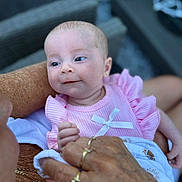 Layla-Mae joined the competition — help win amazing prizes! baby, infant, pink_clothing, bow, hand, ring, elderly_person, chain, skin, face, blue_eyes, candid, portrait, closeup, outdoor, holding, love, generations, tenderness, family