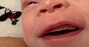 Layla is registered to the contest to win money with this photo: baby, child, closeup, cute, detail, expression, eye, face, head, human, infant, mouth, newborn, nose, person, portrait, skin, sleepy, soft, toddler