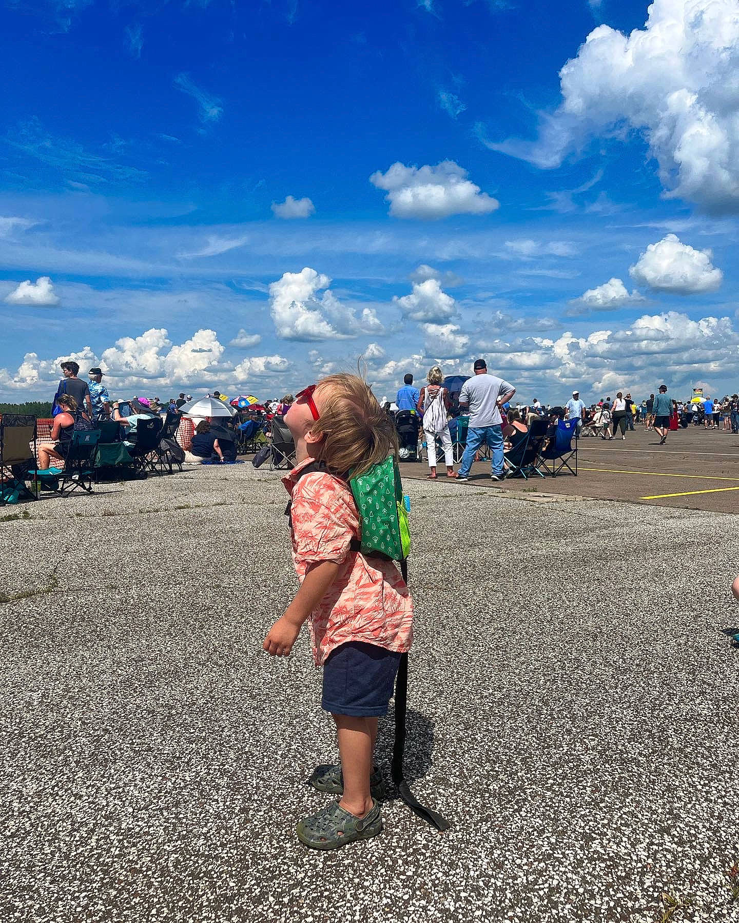 Steven is registered to the contest to win money with this photo: asphalt, azure, blue, body_of_water, cloud, cumulus, fun, happy, horizon, landscape, leisure, natural_environment, people_in_nature, people_on_beach, person, shorts, sky, summer, sunlight, toddler