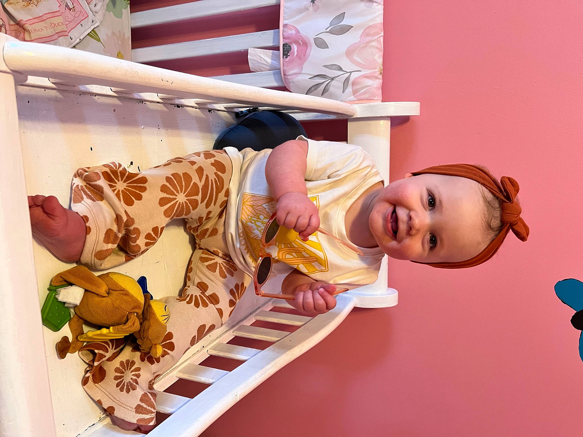 Adilynn joined the competition — help win amazing prizes! baby_products, bed, child, comfort, doll, eyelash, fun, happy, human_body, joy, leisure, magenta, peach, person, pink, room, sandal, shelf, smile, stuffed_toy