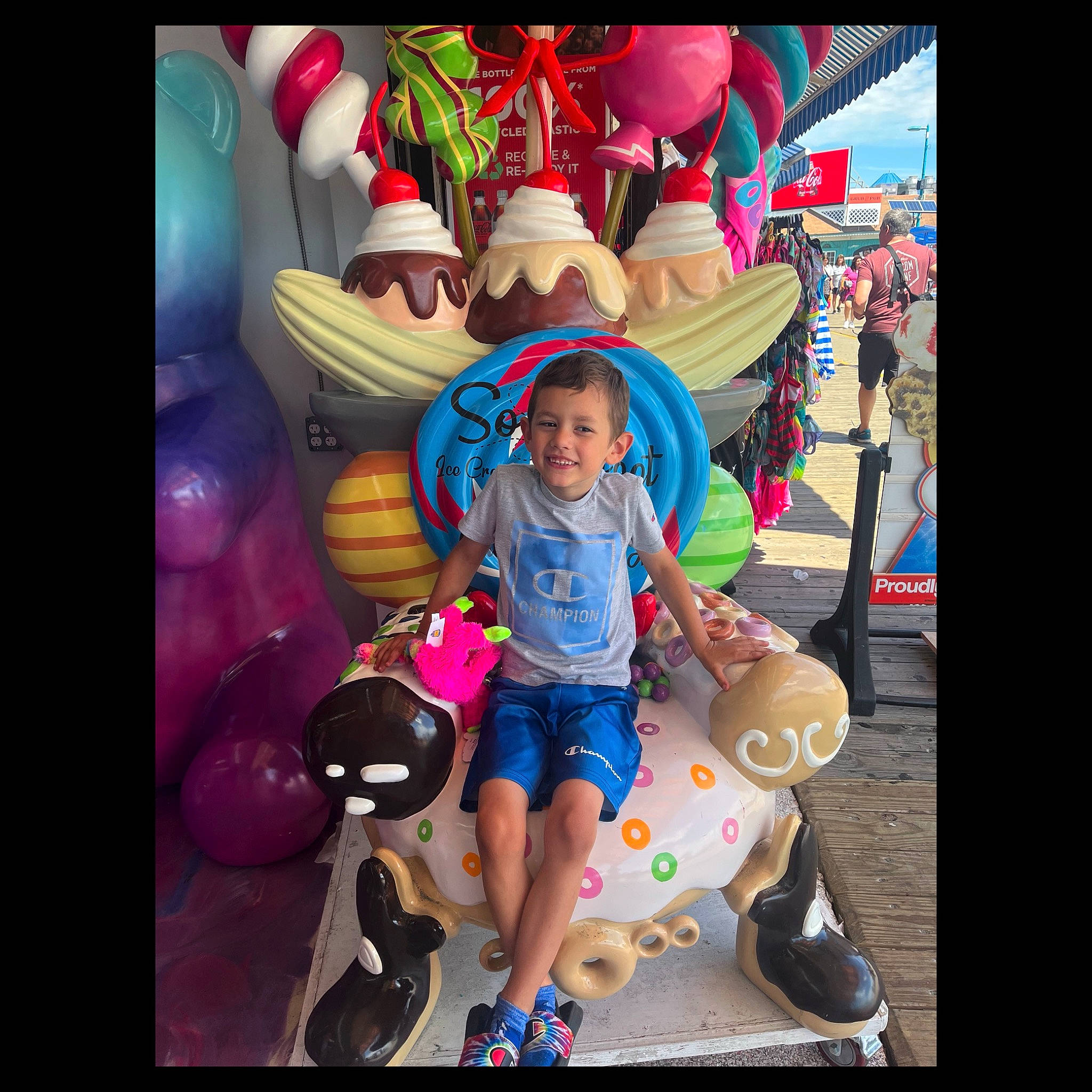 Noah is registered to the contest to win money with this photo: animated_cartoon, animation, art, child, entertainment, event, fictional_character, fun, happy, illustration, joy, leisure, magenta, person, pink, play, recreation, shorts, t_shirt, toddler