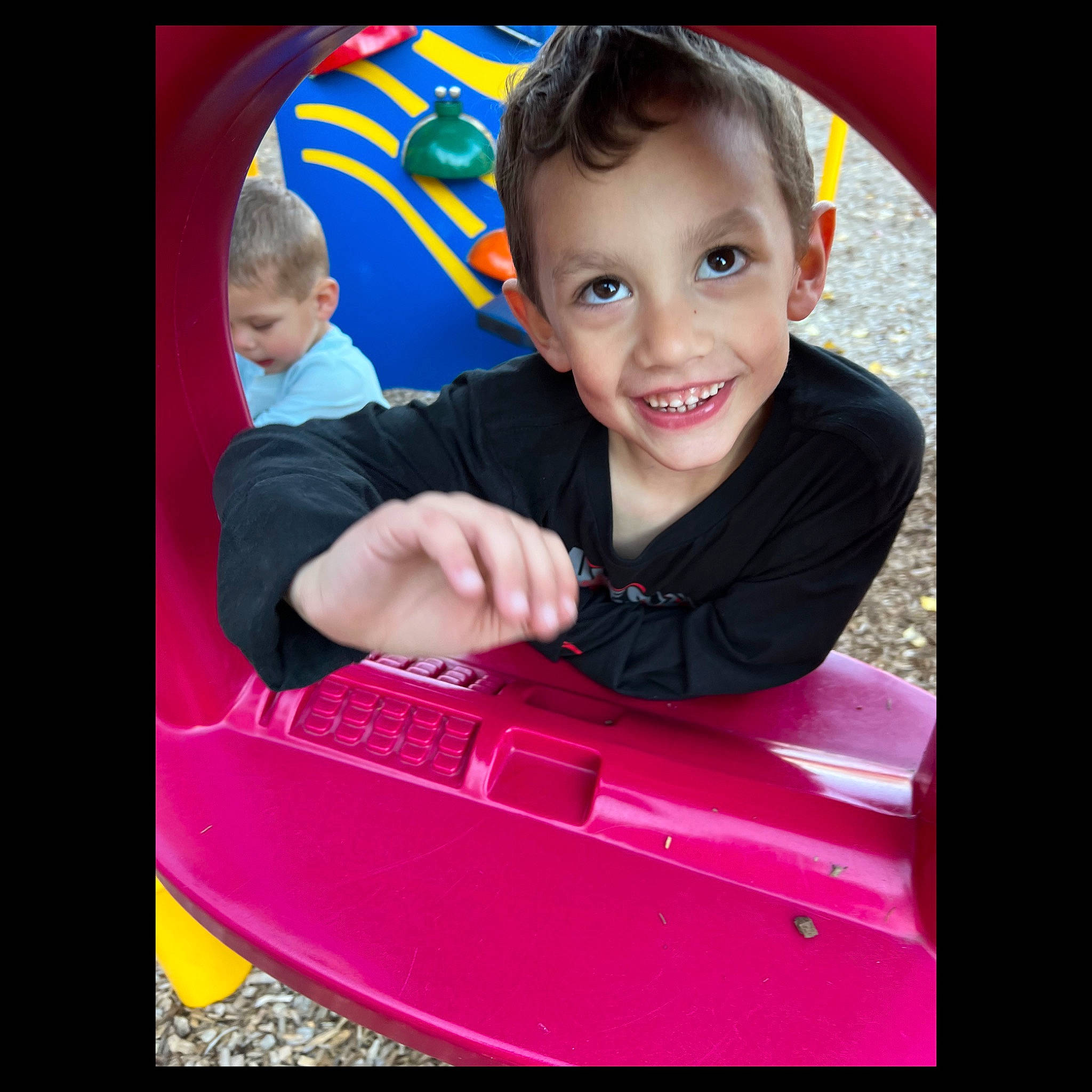 Noah is registered to the contest to win money with this photo: baby, baby_toddler_clothing, child, design, electric_blue, electronic_device, flash_photography, fun, happy, joy, magenta, person, pink, product, shirt, sitting, sleeve, smile, t_shirt, technology