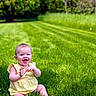 baby, child, grass, outdoor, greenery, smiling, happy, yellow_dress, nature, summer, cute, sitting, portrait, sunlight, trees, one_person, infant, lawn, playful, cheerful