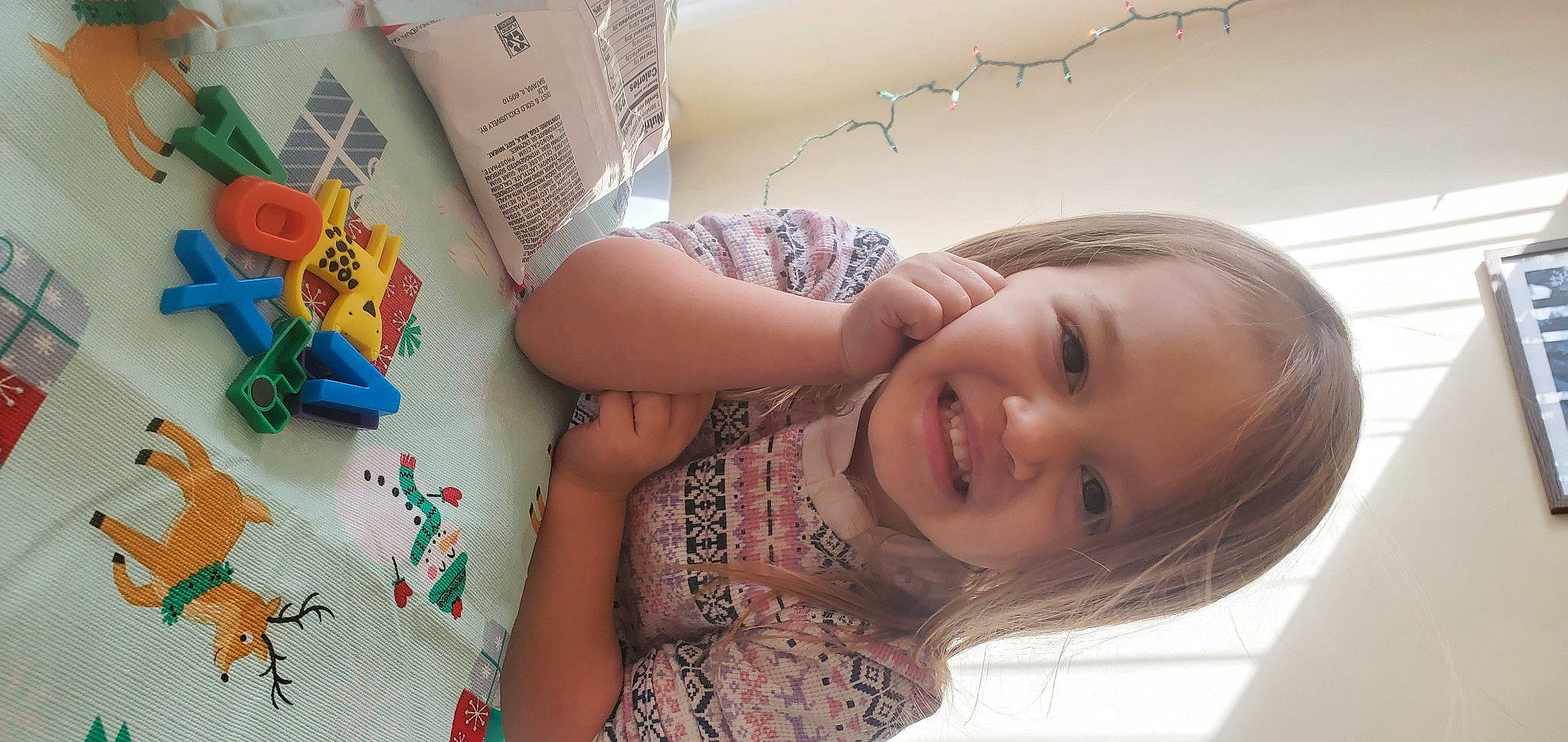 Kelsi is registered to the contest to win money with this photo: arm, cheek, child, dress, eyelash, fun, happy, joy, mouth, nose, pattern, people, person, product, room, skin, smile, summer, t_shirt, toddler