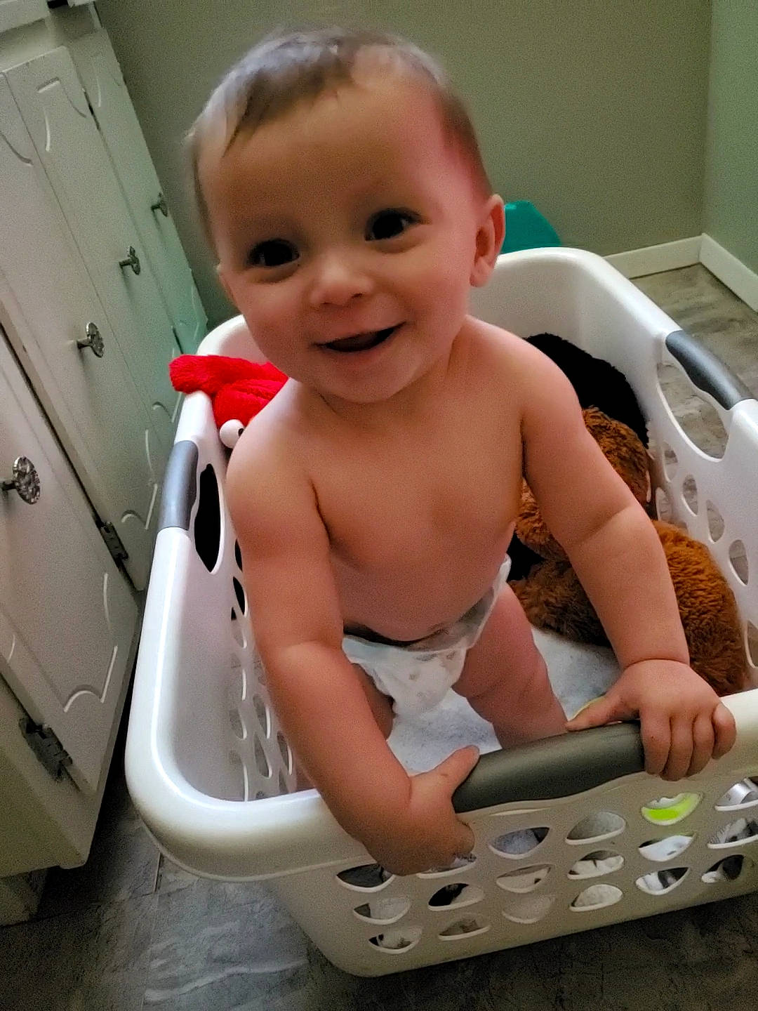 Roman is registered to the contest to win money with this photo: baby, bathing, cabinetry, cheek, chest, facial_expression, finger, fun, hairstyle, hand, happy, human_body, joy, mouth, muscle, person, skin, smile, standing, thigh