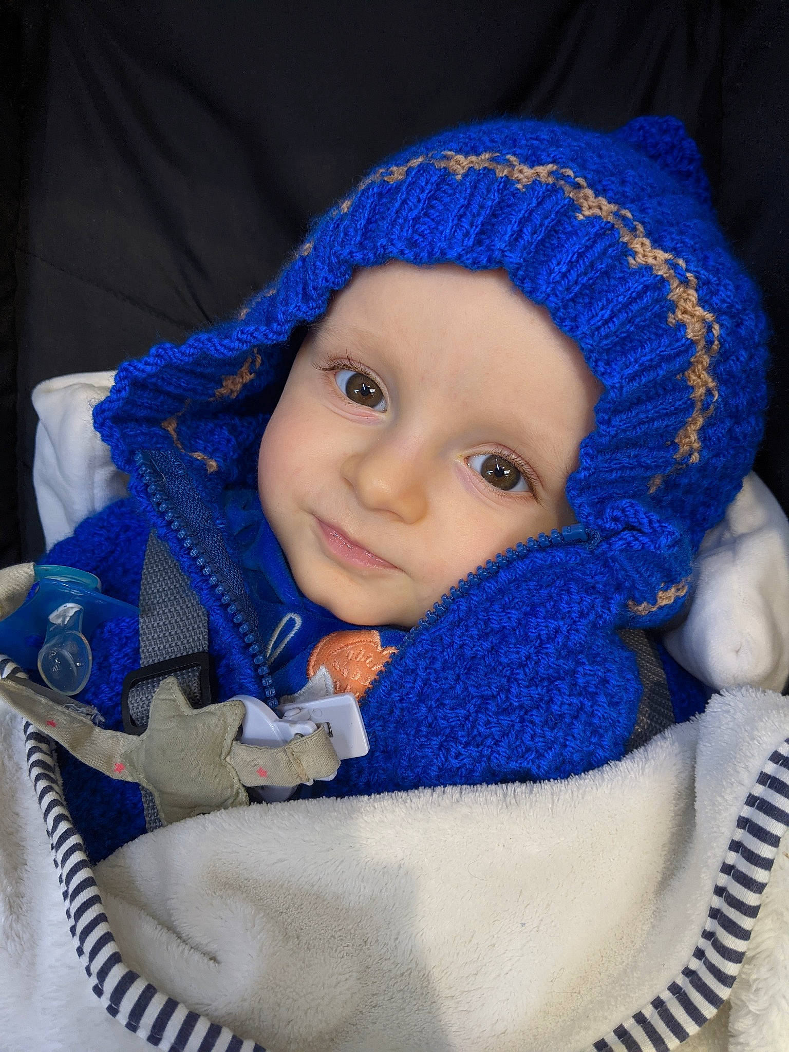 Adrien participe au concours pour gagner de l'argent avec cette photo : baby, baby_carriage, baby_toddler_clothing, blue, cap, cheek, electric_blue, eye, face, head, headgear, headwear, iris, organ, outerwear, person, product, skin, smile, toddler