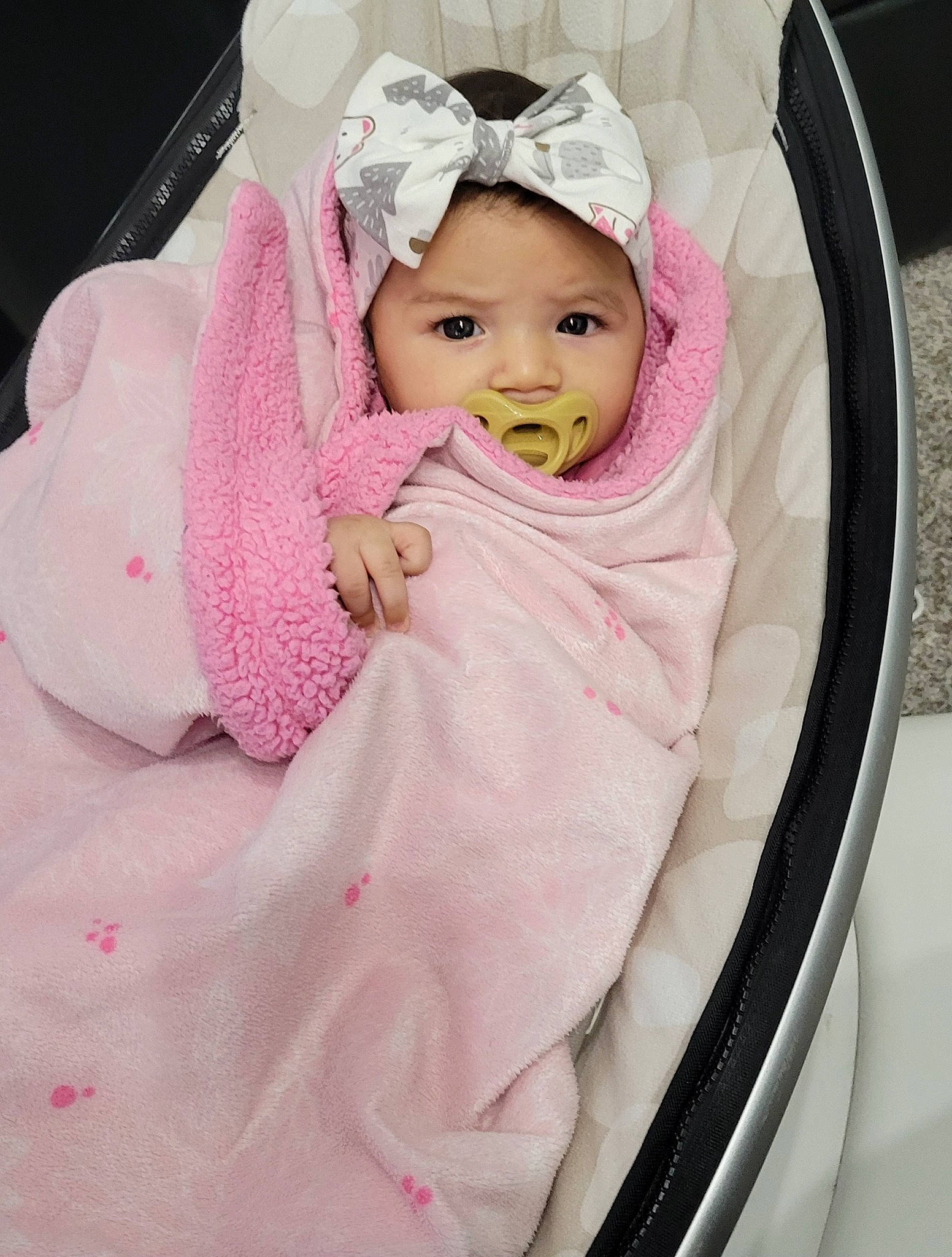 Reina is registered to the contest to win money with this photo: baby, baby_carriage, baby_products, baby_safety, baby_sleeping, baby_toddler_clothing, beanie, cheek, child, comfort, fashion_accessory, headwear, infant_bed, linens, magenta, peach, person, pink, product, room